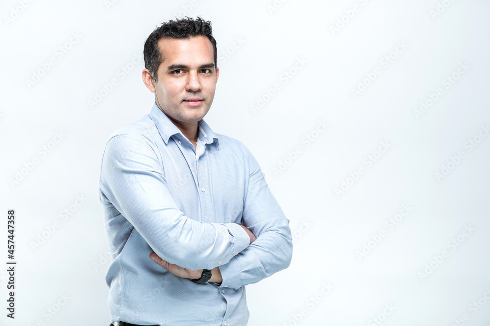An Asian working man in an office suit is standing with her arms crossed and confidently smiling faces, on white background. An Asian working man in an office suit is standing with her arms crossed and confidently smiling faces, on white background.