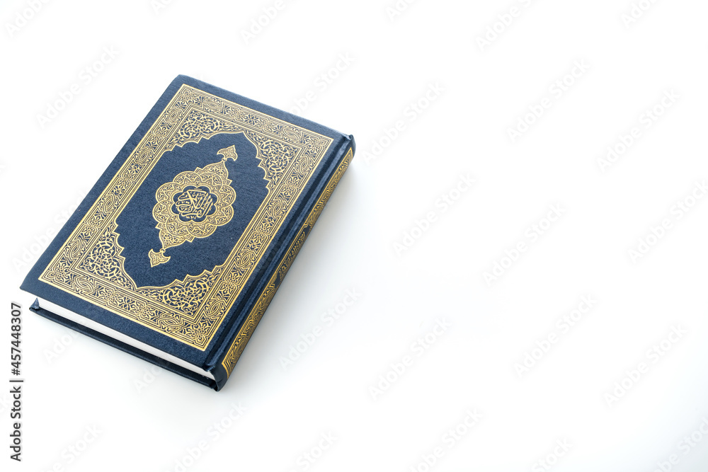 Islamic concept - The Holy Al Quran with written Arabic calligraphy meaning of Al Quran, Arabic word translation: The Holy Al Quran (holy book of Muslim), on white background, with copy space. Islamic concept - The Holy Al Quran with written Arabic calligraphy meaning of Al Quran, Arabic word translation: The Holy Al Quran (holy book of Muslim), on white background, with copy space.