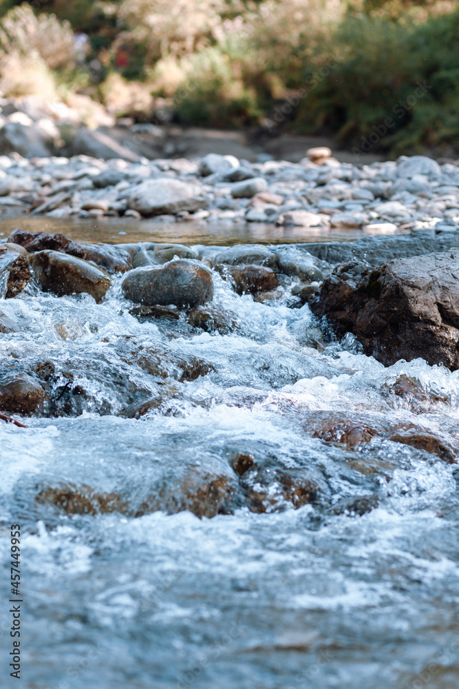A fast-flowing wide and full-flowing mountain river. A fast-flowing wide and full-flowing mountain river.