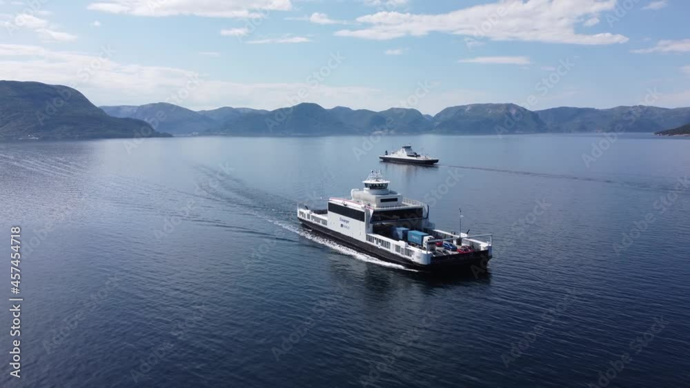 Following along ships side of Norled car ferry Mf Stavanger while crossing Sognefjord heading for Lavik - Aerial with ferry Oppedal in background - Norway Following along ships side of Norled car ferry Mf Stavanger while crossing Sognefjord heading for Lavik - Aerial with ferry Oppedal in background - Norway