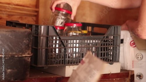 Taking Glass Jars from Cardboard Storage Boxes To Reuse Again For Homemade Preserves and Jam. Sustainable Homestead Life photo