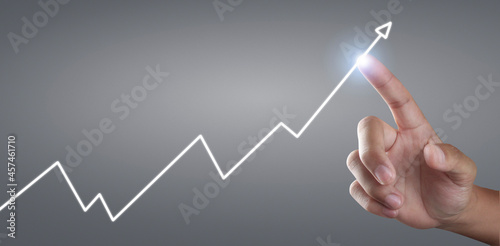 Touching graphs of financial indicator and accounting market economy analysis chart