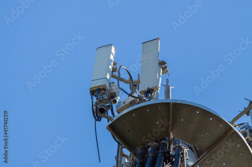 telecommunications tower of different mobile phone, radio and television operators with masts and microwave radio link antennas, 4g and deployment of 5g generation in cities and rural areas 