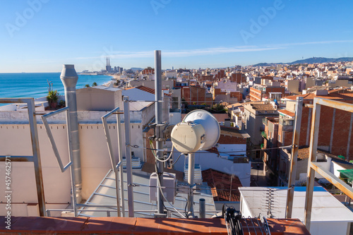 telecommunications tower of different mobile phone, radio and television operators with masts and microwave radio link antennas, 4g and deployment of 5g generation in cities and rural areas  photo