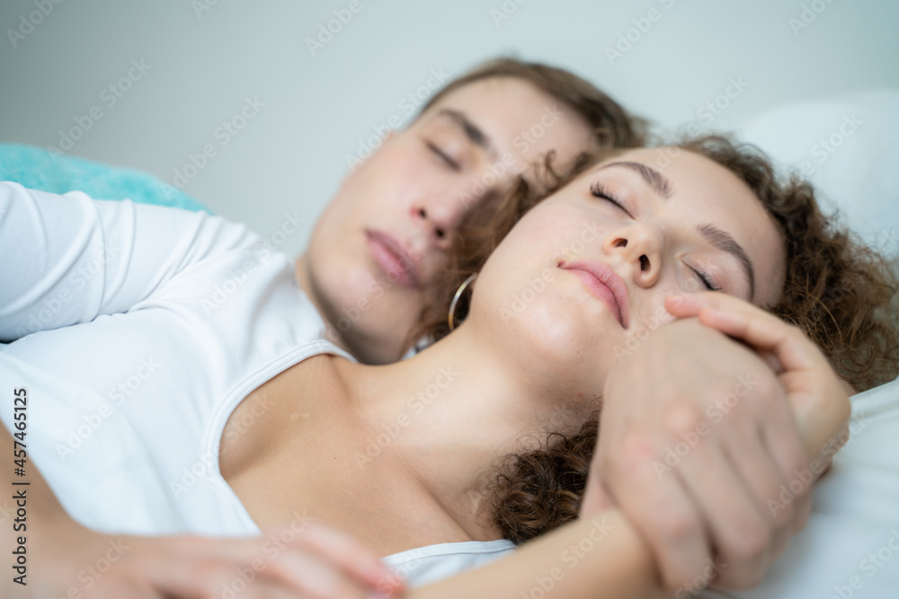Couple sleep in morning on white bed cozy room Couple sleep in morning on white bed cozy room