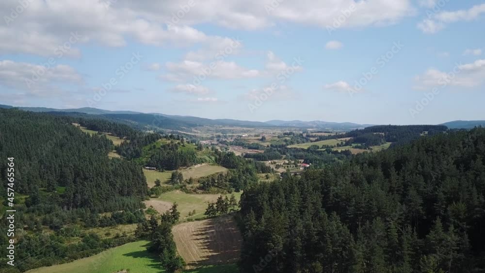 Summer Landscape Of Langogne In Lozere, France With Dense Forests On Green Hills. aerial pullback Summer Landscape Of Langogne In Lozere, France With Dense Forests On Green Hills. aerial pullback