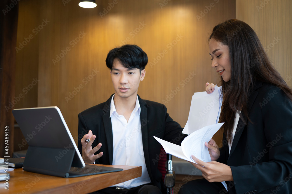 Disabled male working with his colleague in a meeting room. Disabled male working with his colleague in a meeting room.