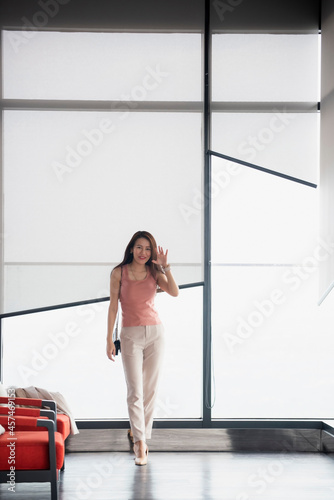 Beautiful Woman Going To Work With Walking Near Office Building.