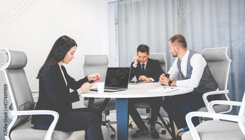 top view Group of young business people working and communicating while sitting at the office desk together with colleagues sitting. business meeting