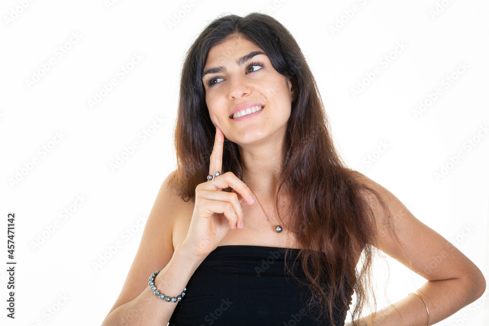 pensive young woman smiling looking up with happy face cute smile posing in white copy space background pensive young woman smiling looking up with happy face cute smile posing in white copy space background