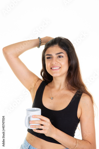 young woman with cup of coffee smiling hand on head hairs with white background