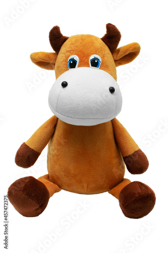 Sitting cow soft toy isolated on white background. Isolate.