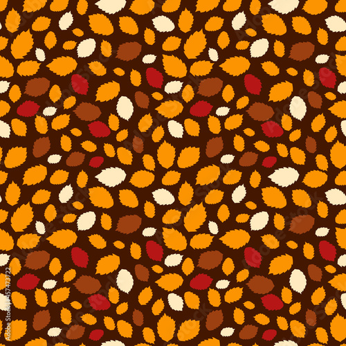 Seamless cute autumn pattern with fall leaves in warm color. Dark background