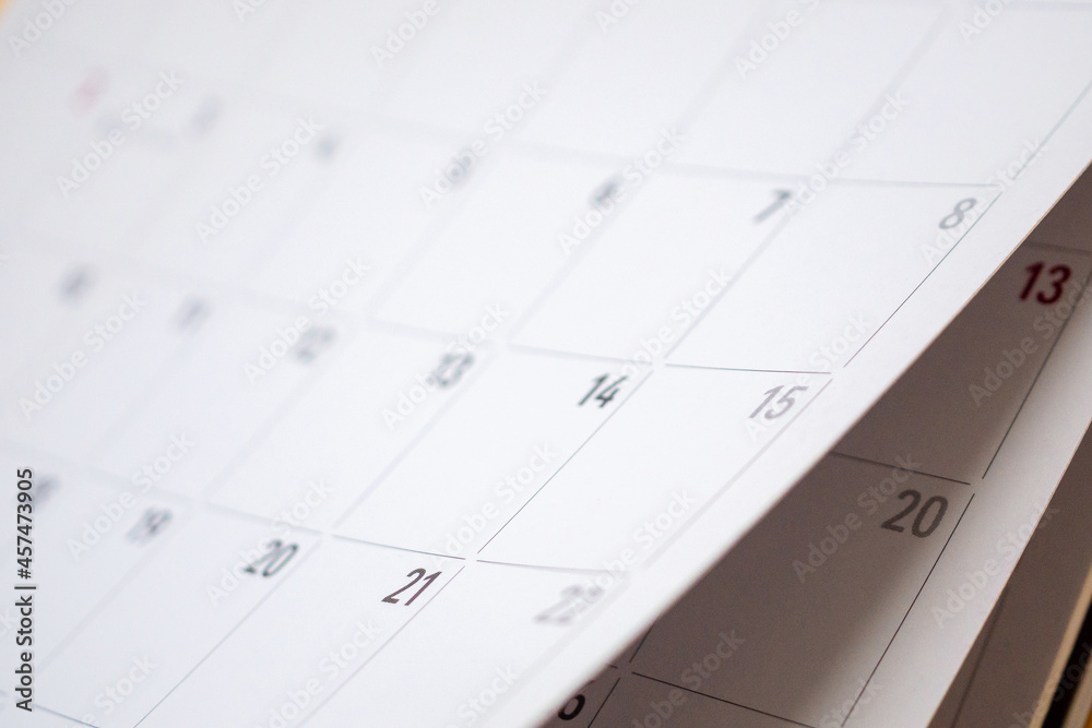 Abstract blur calendar page flipping sheet close up background business schedule planning appointment meeting concept Abstract blur calendar page flipping sheet close up background business schedule planning appointment meeting concept