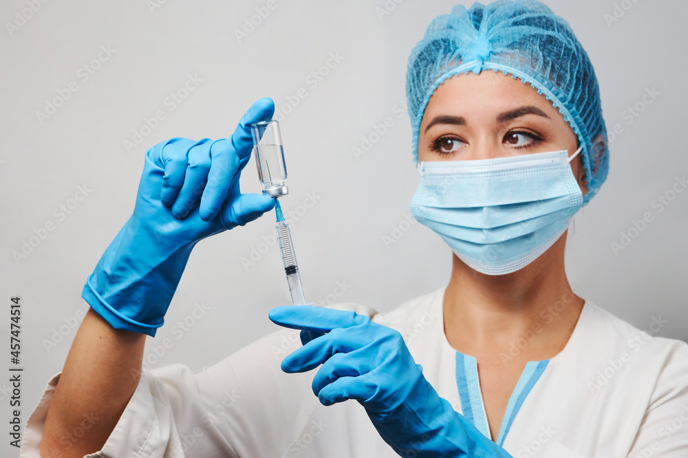 Female doctor injecting injection vaccine, close-up Female doctor injecting injection vaccine, close-up