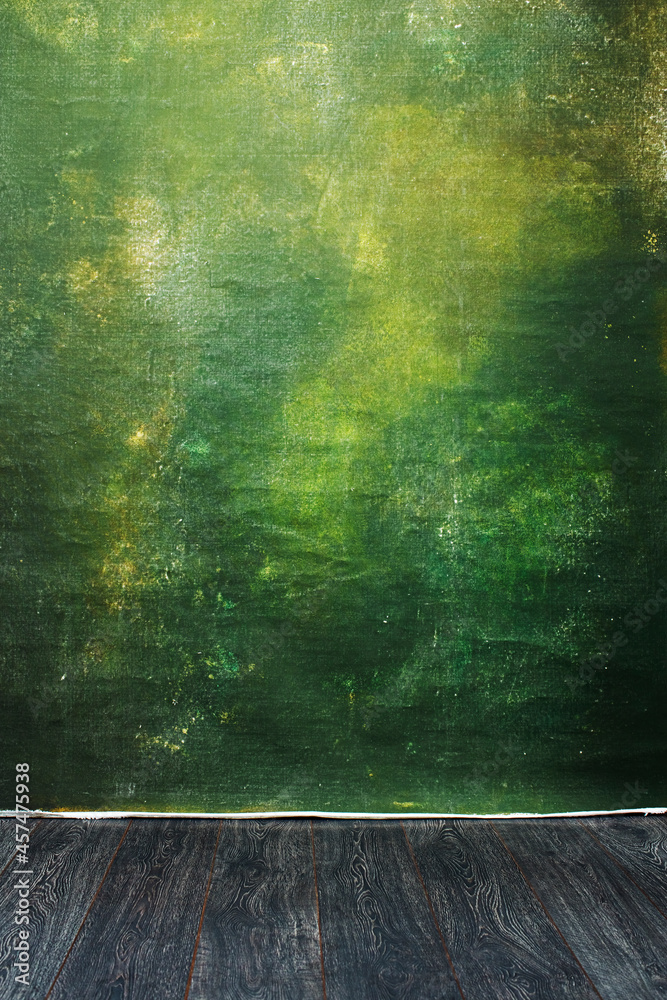 Dramatic  green painted textured canvas and muslin cloth studio backdrop with a wooden platform - obrazy, fototapety, plakaty 