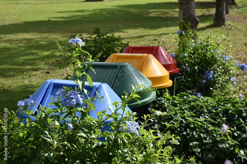 Multi-colored waste bins, classified by type of waste. at the park