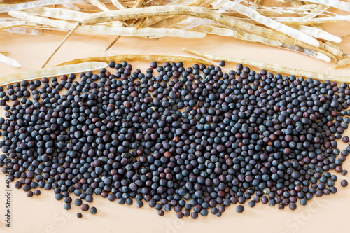 A pile of rapeseed with pods in a pile