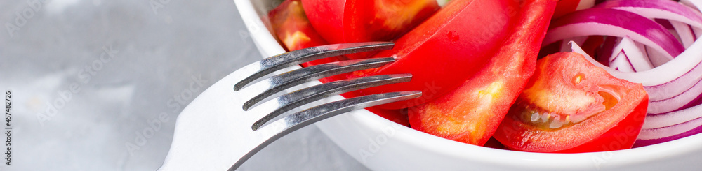 banner of Plate of rainbow salad with different vegetables and herbs in white bowl on grey stone background banner of Plate of rainbow salad with different vegetables and herbs in white bowl on grey stone background
