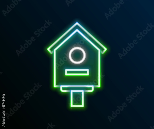 Glowing neon line Bird house icon isolated on black background. Nesting box birdhouse, homemade building for birds. Colorful outline concept. Vector
