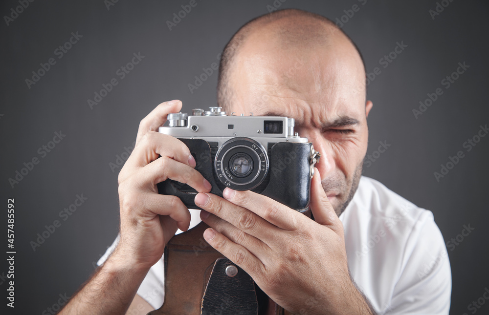Man taking a picture with old camera. Man taking a picture with old camera.