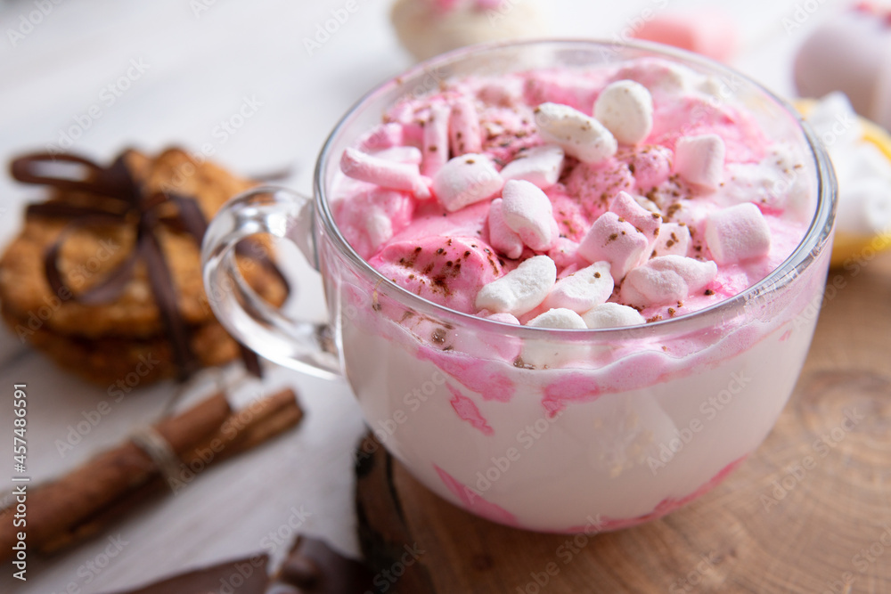 Hot drink with marshmallows on a wooden table. Hot drink with marshmallows on a wooden table.