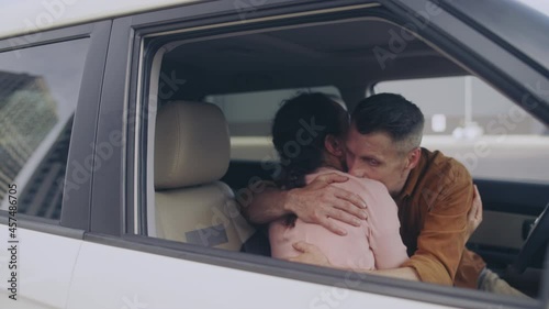 Lovers secretly hugging in the car, looking around, family cheating, love affair