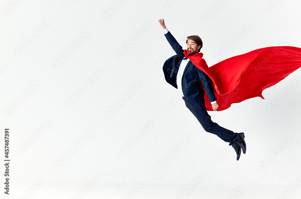 man wearing red cape superman jump