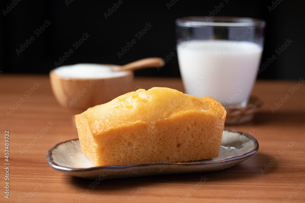 Orange cake with fresh milk on wooden floor Orange cake with fresh milk on wooden floor