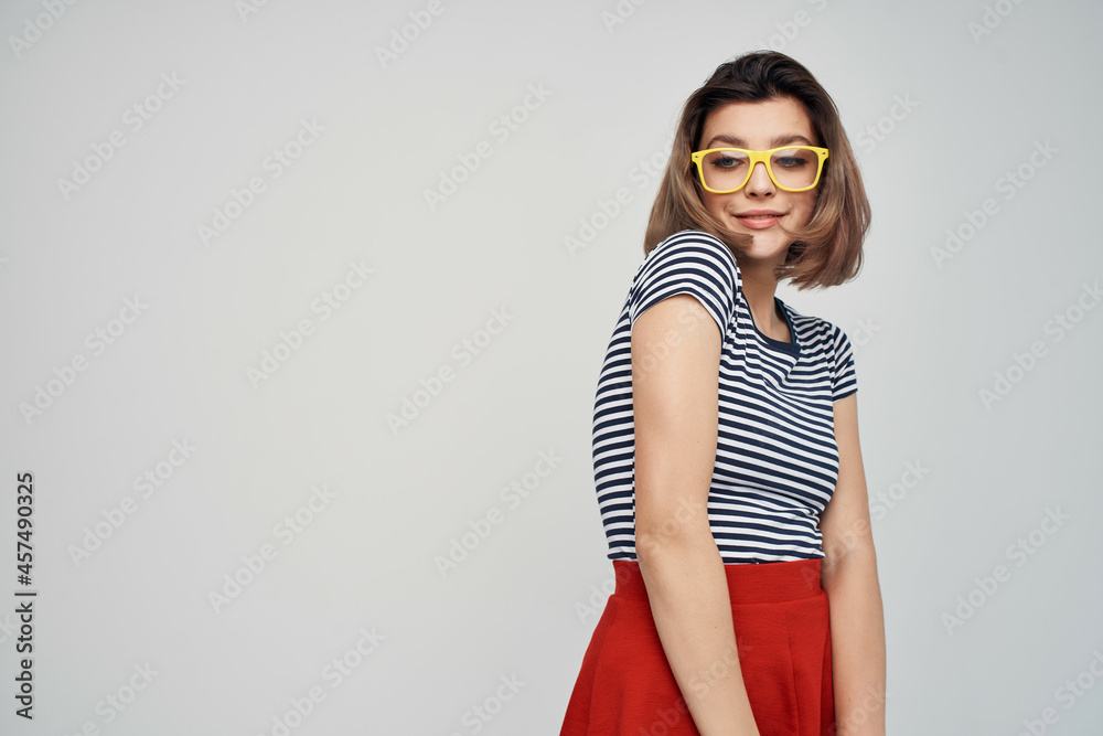 pretty woman in yellow glasses in red skirt fashion summer pretty woman in yellow glasses in red skirt fashion summer