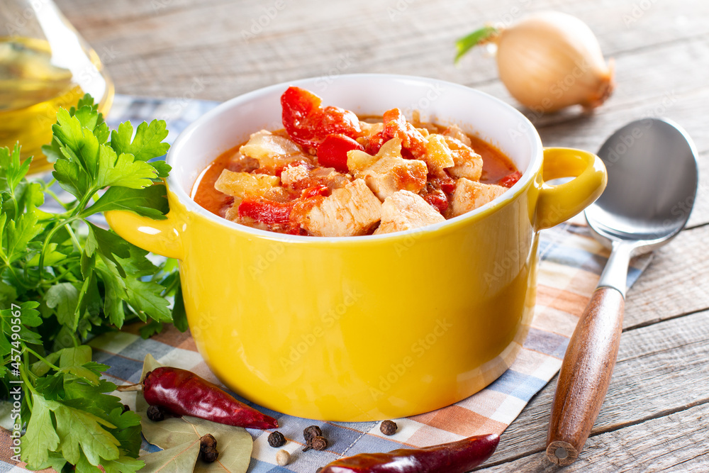 Chicken paprikash - Traditional hungarian chicken cooked in paprika and cream sauce, with ingredients Chicken paprikash - Traditional hungarian chicken cooked in paprika and cream sauce, with ingredients