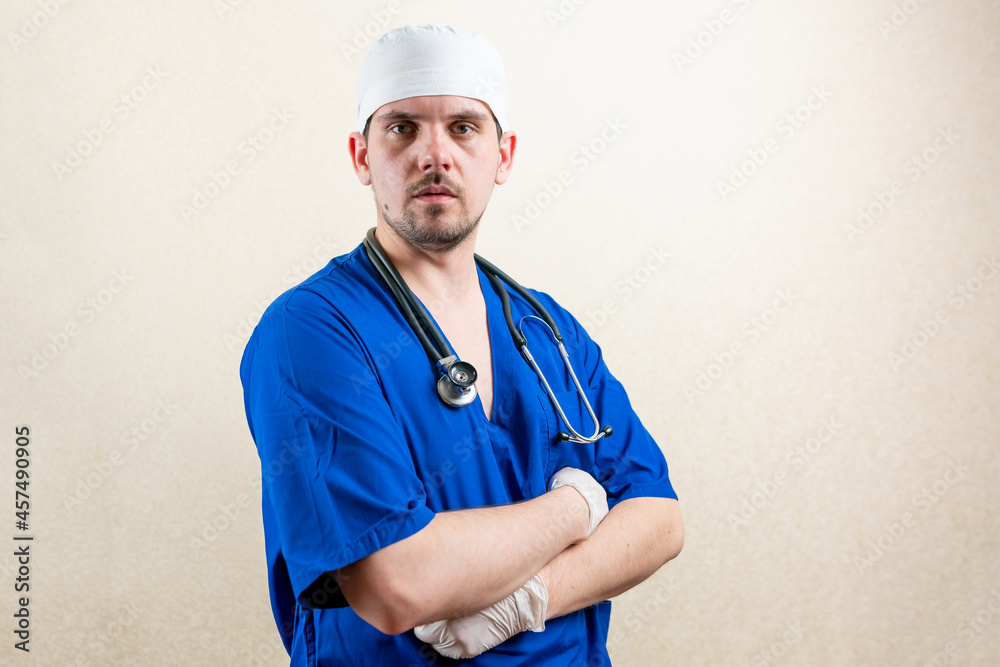 Doctor in mask and blue uniform, shows strength. Doctor in mask and blue uniform, shows strength.