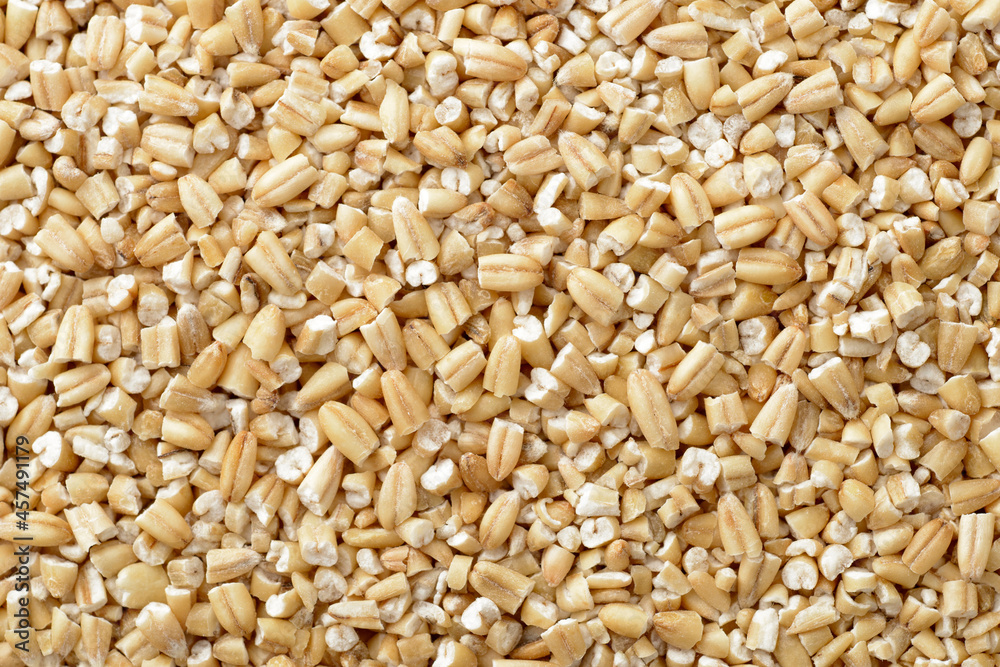food backgroud of uncooked steel cut oats, top view food backgroud of uncooked steel cut oats, top view