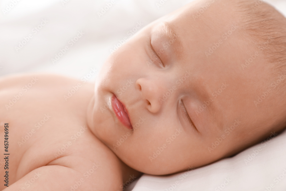 Cute little baby sleeping on bed, closeup Cute little baby sleeping on bed, closeup