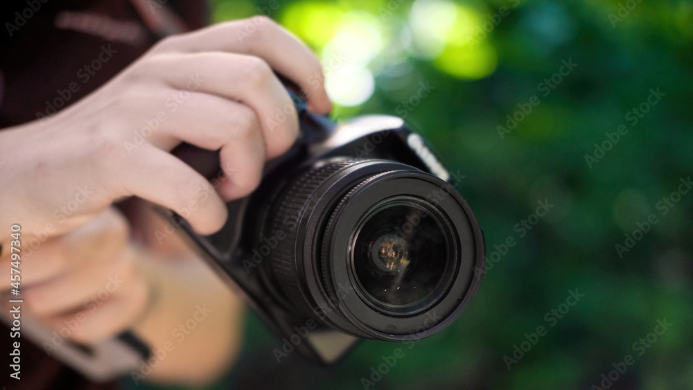 Woman holding a professional camera