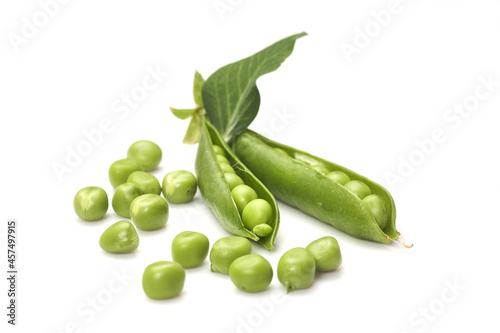 Pods of green peas with leaves isolated on white background