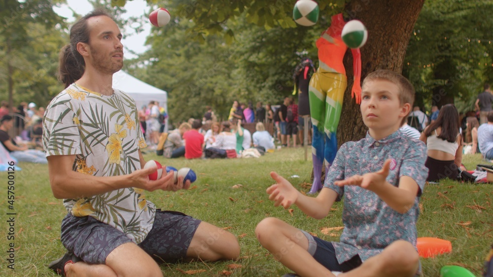 The male teacher shows his skills in the camp. Juggling can help keep