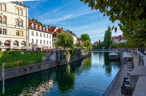 Footbridge Ribja brv over Ljubljanica river with river bank