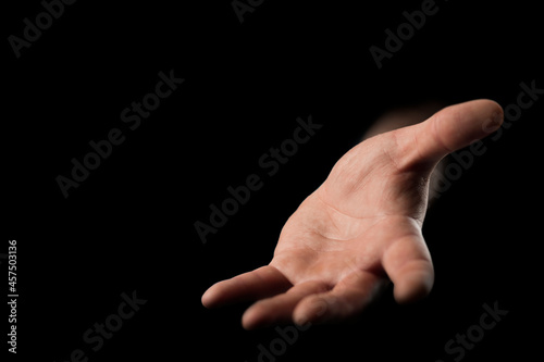stretches out his hand from darkness, place to place text or object