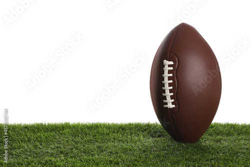 Leather American football ball on lawn against white background