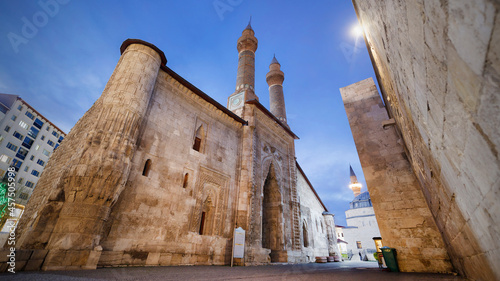 Double Minaret Madrasah was built in 1271 Ilhanli period. The tile decorations on the minarets are remarkable. Sivas, Turkey. photo