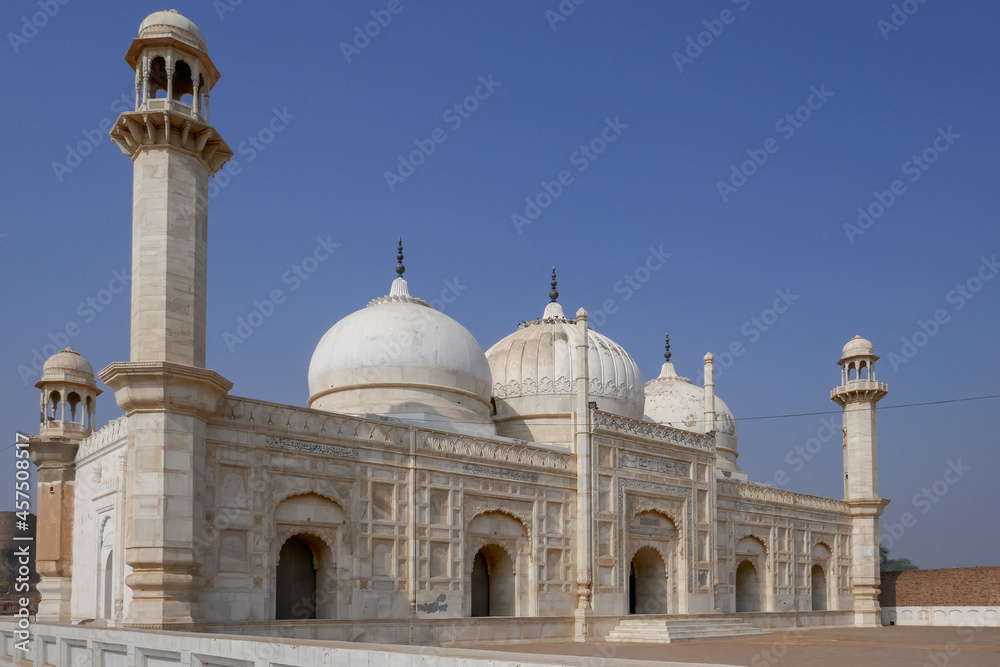 Side view of beautiful white marble Abbasi mughal style mosque outside Derawar fort in Cholistan desert, Bahawalpur, Punjab, Pakistan