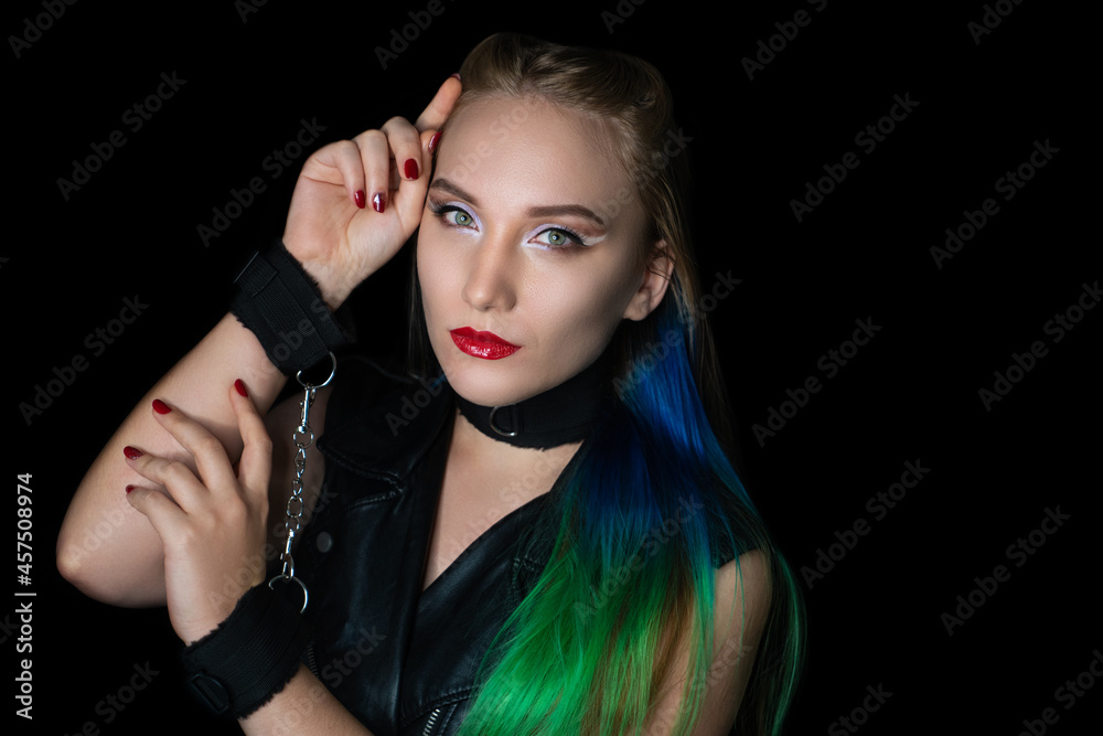 New creative make-up, conceptual art idea. White shadows, vivid colors graphic shapes lines, cosmetics, necklace choker. close-up skincare and hands care. perfect straight colorful hair. handcuffs New creative make-up, conceptual art idea. White shadows, vivid colors graphic shapes lines, cosmetics, necklace choker. close-up skincare and hands care. perfect straight colorful hair. handcuffs
