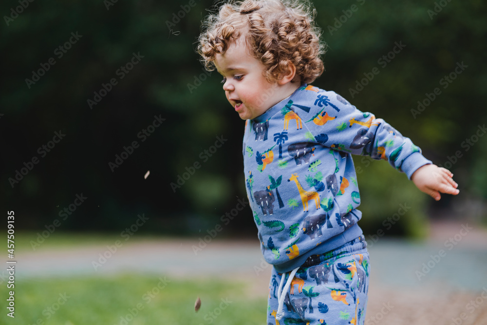 Fototapeta premium little child playing in the park