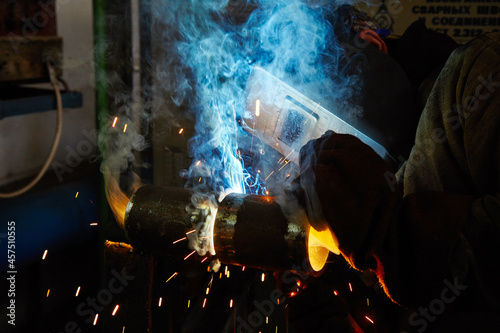 Electric welder at work. Type of profession. Industry
