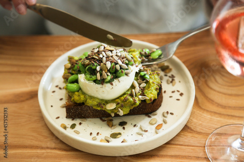 Healthy avocado toast with cheese and seeds