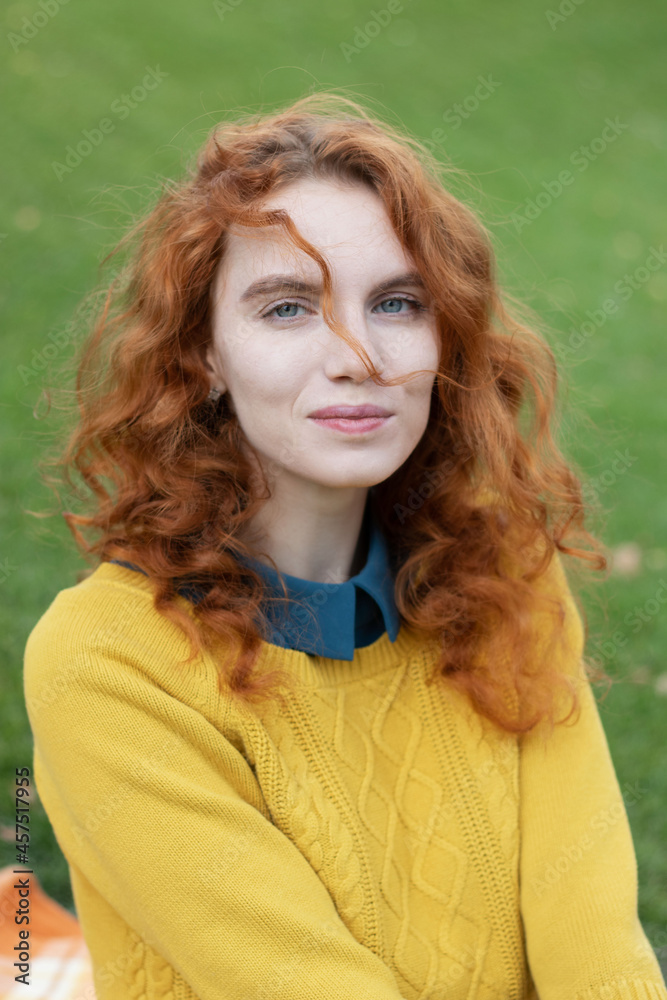 beautiful red-haired girl in a yellow sweater portrait beautiful red-haired girl in a yellow sweater portrait