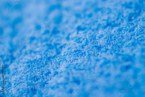 A blue sponge for cleaning surfaces in the kitchen and bathroom.