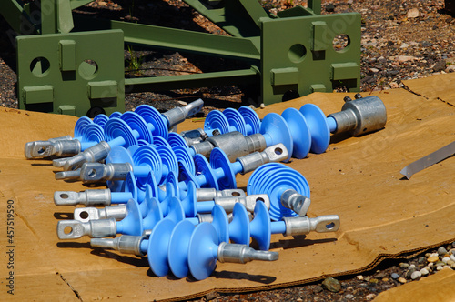 Catenary mast and insulators ready for installation. photo