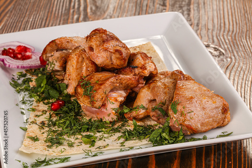 Grilled chicken barbecue served herbs